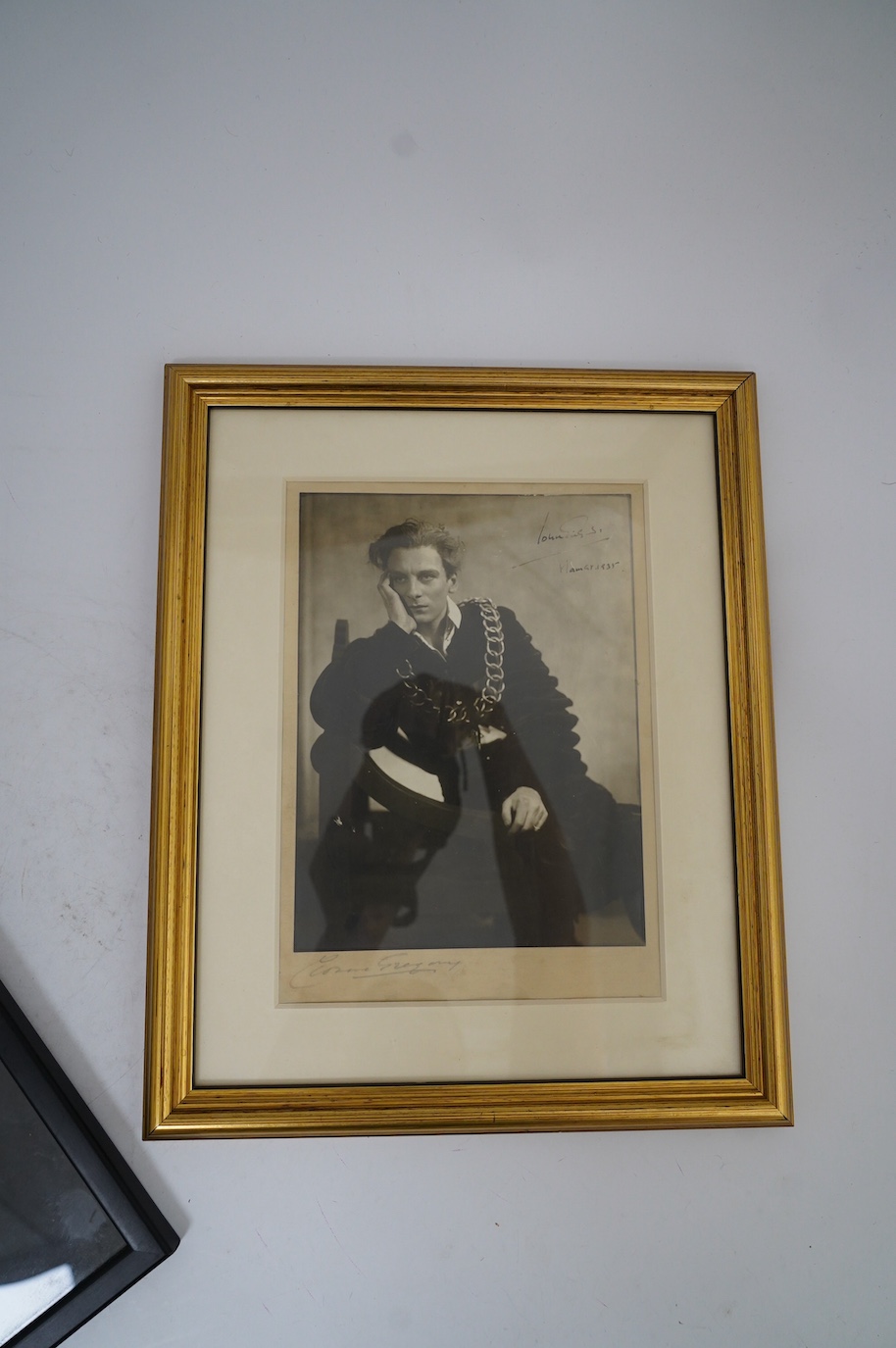 A theatrical archive of signed photos, a poster and books relating to John Gielgud and Laurence Olivier, including; a framed signed photograph of John Gielgud as Hamlet dated 1935, together with two signed photographs da